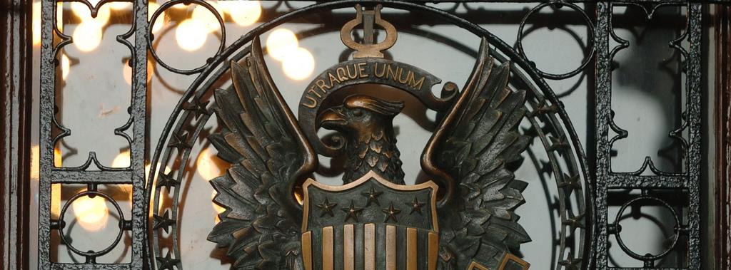 Close-up of the eagle and shield that adorn the Healy Hall gate